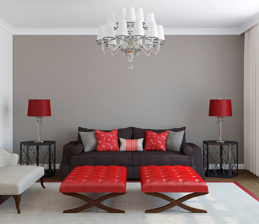 This modern and simplistic room accents a monochrome design with a vibrant red. The red makes a modern design have a great deal of pop and visual appeal. This modern and simplistic room accents a monochrome design with a vibrant red. The red makes a modern design have a great deal of pop and visual appeal.