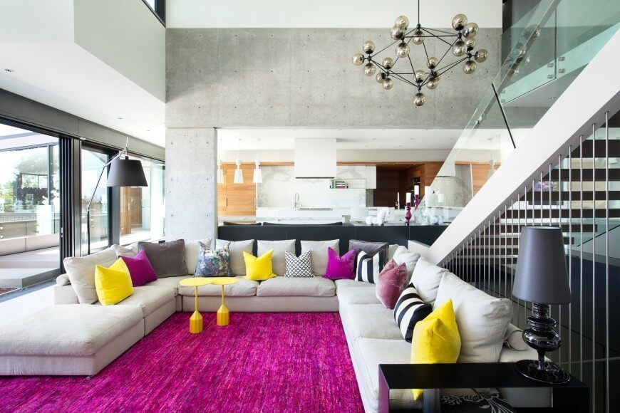 A very colorful carpet and pillows give this simple room a very fun appeal. A very colorful carpet and pillows give this simple room a very fun appeal.