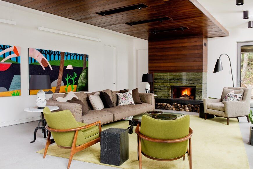 This room uses a piece of art to inform a bright and interesting color palette in this living room. The green marble fire place is an interesting piece that ties together the color scheme. This room uses a piece of art to inform a bright and interesting color palette in this living room. The green marble fire place is an interesting piece that ties together the color scheme.