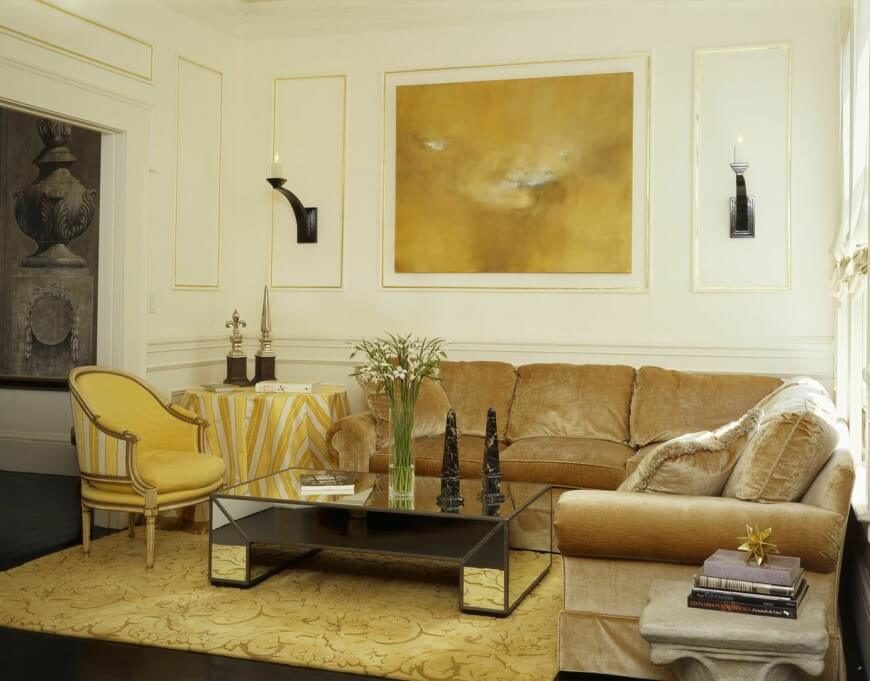 There is a good use of reflective surfaces and gold to build a very luxurious living room. There is a good use of reflective surfaces and gold to build a very luxurious living room.
