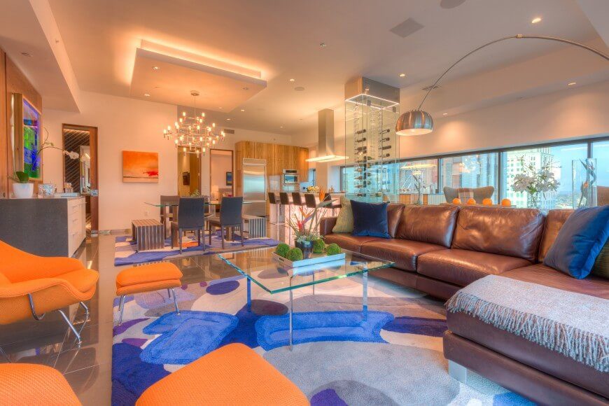 This fun and vibrant room uses blue and orange to play off of each other to make an energetic and joyous space. Blue and orange are complimentary colors, and complimentary colors are always good together. This fun and vibrant room uses blue and orange to play off of each other to make an energetic and joyous space. Blue and orange are complimentary colors, and complimentary colors are always good together.
