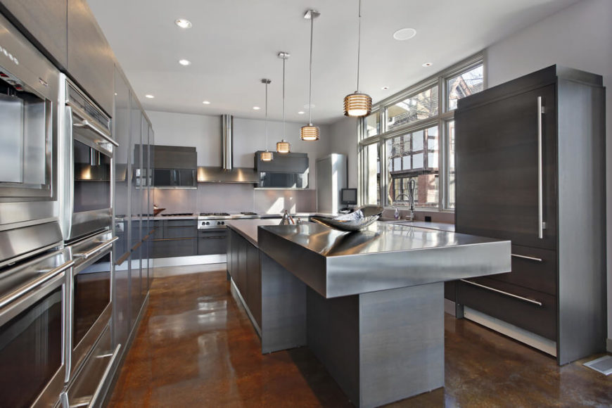 An entirely metal kitchen with stainless steel appliances and a two-tier brushed nickel island. An entirely metal kitchen with stainless steel appliances and a two-tier brushed nickel island.