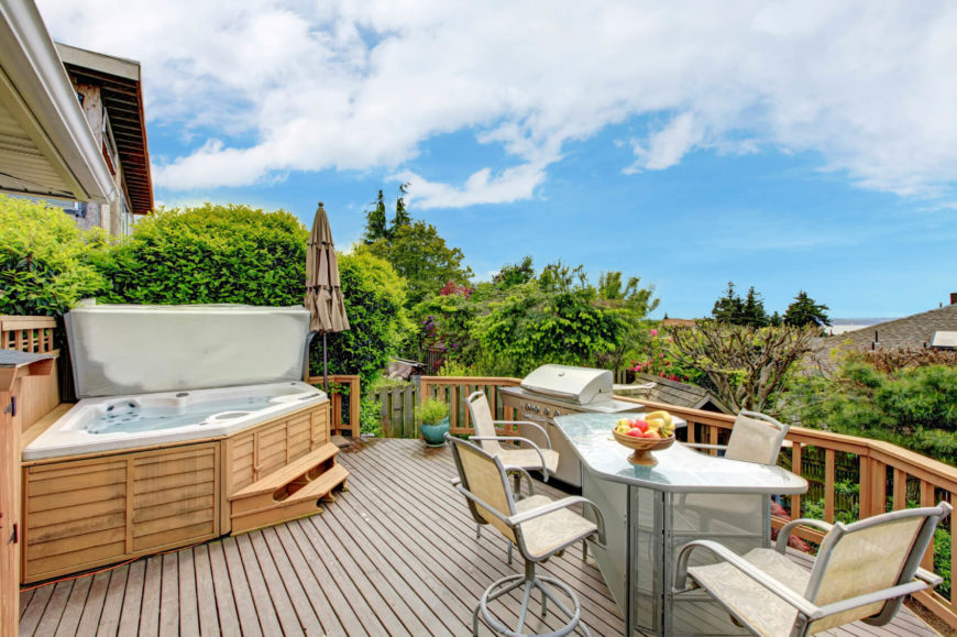 You don't have to make the hot tub the center of your social area. A hot tub can fit well into a corner, out of the way until you need or want it. You don't have to make the hot tub the center of your social area. A hot tub can fit well into a corner, out of the way until you need or want it.