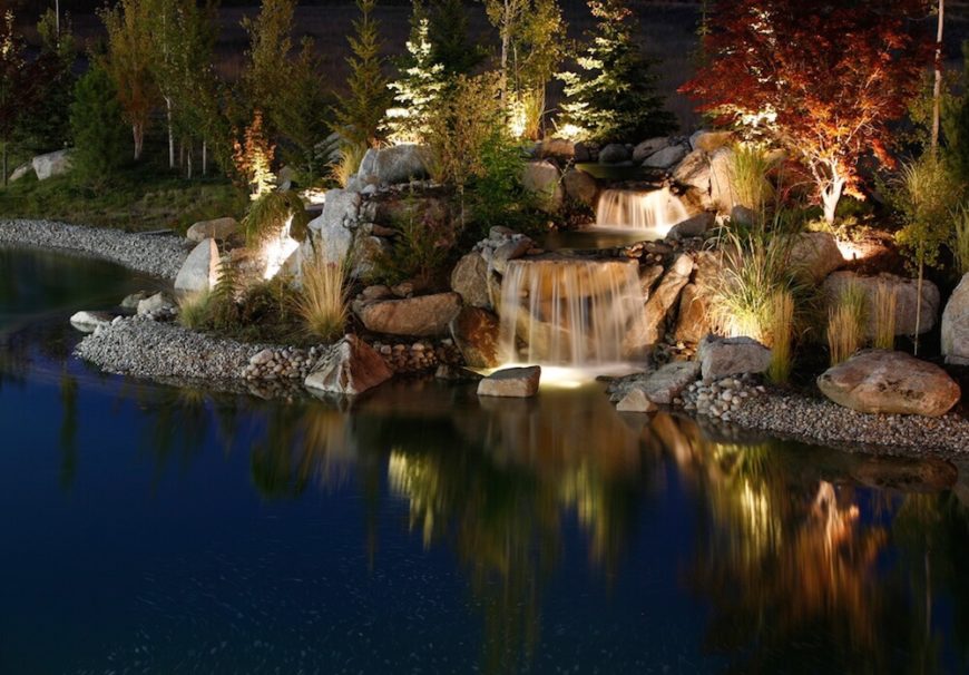 Here we see a number of well lights casting light upward along the plants in this garden. With this type of lighting your garden and trees appear as beacons in the night.