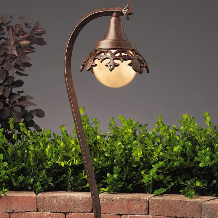 Here is another lantern with an iron look. This one has a bulb pointing downwards, providing focus and directing light to the plants underneath. No one will miss your spectacular garden with this lantern shining down on your plants.