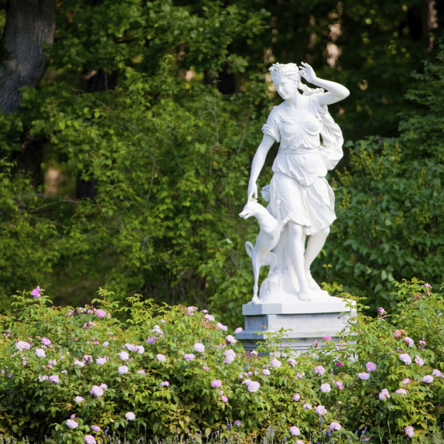 Here is another classic style statue in stone. This stone is stark white, which has a bright appeal that works very well with flowers. This is the ideal kind of sculpture to set in the garden. Here is another classic style statue in stone. This stone is stark white, which has a bright appeal that works very well with flowers. This is the ideal kind of sculpture to set in the garden.