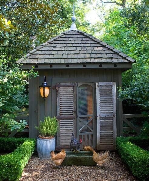 We cannot resist an adorably constructed chicken coop with quaint rustic styling. This large structure features a handsome black metal sconce and is even flanked by miniature hedge rows. We cannot resist an adorably constructed chicken coop with quaint rustic styling. This large structure features a handsome black metal sconce and is even flanked by miniature hedge rows.