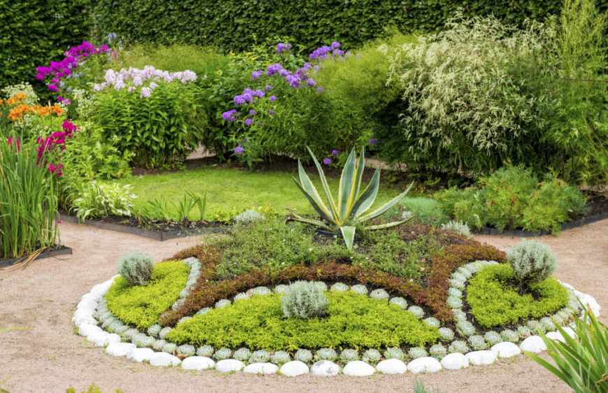 Here is a well designed and organized plant garden. Plant gardens such as this make a perfect centerpiece for a landscape. It is the perfect focus point for your yard and really heightens your design. Here is a well designed and organized plant garden. Plant gardens such as this make a perfect centerpiece for a landscape. It is the perfect focus point for your yard and really heightens your design.