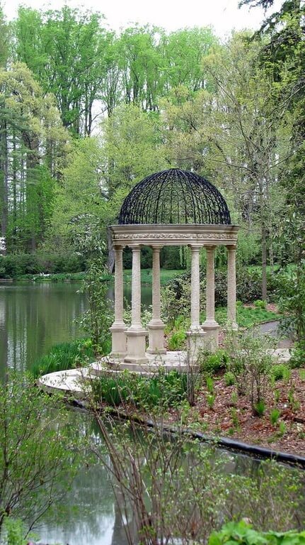 Incredible stone and iron gazebo on the edge of a lake. Incredible stone and iron gazebo on the edge of a lake.