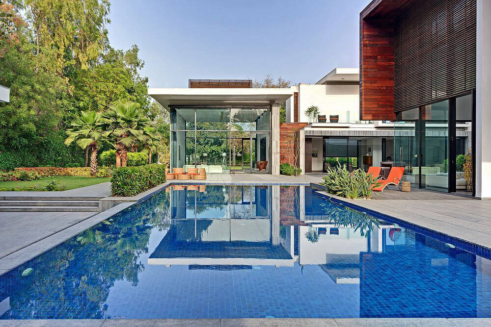 This home's swimming pool beautifully mirrors the blue skies.