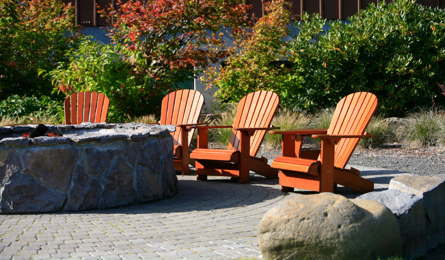 Small round stucco covered built-in fire pit on patio. Small round stucco covered built-in fire pit on patio.