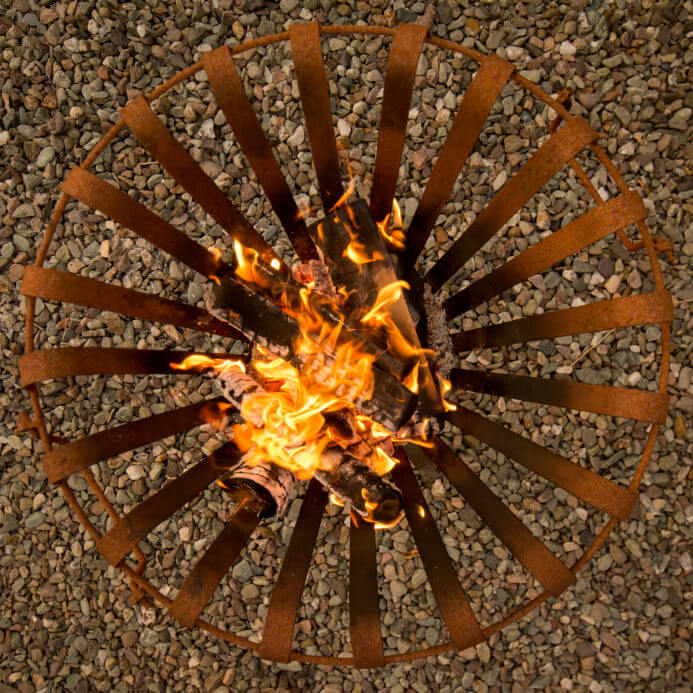 Overhead view of a small movable metal grate style fire pit. Overhead view of a small movable metal grate style fire pit.