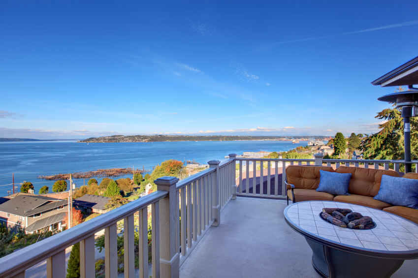 Oval fire pit with flat surface area placed on balcony overlooking the ocean. Oval fire pit with flat surface area placed on balcony overlooking the ocean.