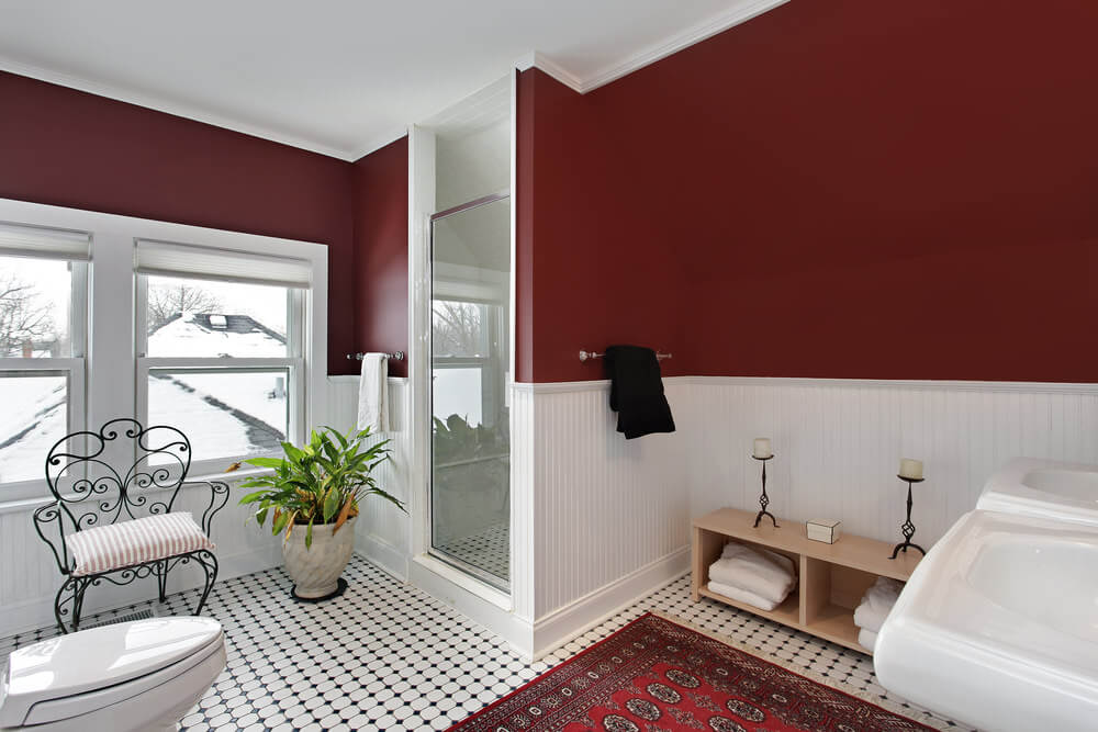 Patterned black and white floor texture with red floor carpet. The contrast of the red oxide and white colored wall adds a strong mood to the design. Moreover, the tan wood vanity and add on like the cushioned chair and marbled potted plants show off a cool atmosphere. Patterned black and white floor texture with red floor carpet. The contrast of the red oxide and white colored wall adds a strong mood to the design. Moreover, the tan wood vanity and add on like the cushioned chair and marbled potted plants show off a cool atmosphere.