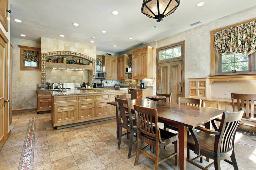 This is another great example of a Mission-style Craftsman kitchen, featuring stonework, handcrafted tiles, and light maple cabinetry. The textured walls evoke Southwestern style. This is another great example of a Mission-style Craftsman kitchen, featuring stonework, handcrafted tiles, and light maple cabinetry. The textured walls evoke Southwestern style.