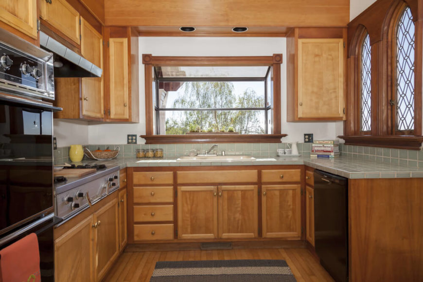 Craftsman style is known for the incredible windows, and this kitchen has several types. The extended window above the sink is like a mini greenhouse for an herb garden, while the more decorative windows to the right let in light without sacrificing privacy. Craftsman style is known for the incredible windows, and this kitchen has several types. The extended window above the sink is like a mini greenhouse for an herb garden, while the more decorative windows to the right let in light without sacrificing privacy.