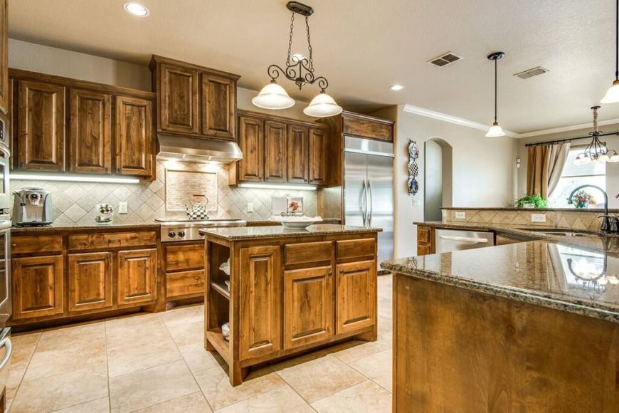 It can be difficult to create a fully Craftsman style, which is a great reason to show you kitchens that have a few details that don't quite fit the Craftsman by-the-book style. Here, we see the light fixtures, which are a little ornate for Craftsman style. It can be difficult to create a fully Craftsman style, which is a great reason to show you kitchens that have a few details that don't quite fit the Craftsman by-the-book style. Here, we see the light fixtures, which are a little ornate for Craftsman style.