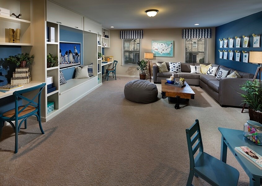 Using brighter colors, like blue, as accent colors is a great way to add a bit of fun to a family room Using brighter colors, like blue, as accent colors is a great way to add a bit of fun to a family room