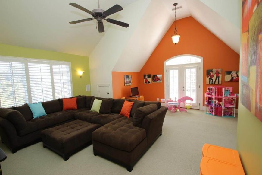 Tall ceilings give this family room a sense of space that's perfect in an attic family room and playroom. Tall ceilings give this family room a sense of space that's perfect in an attic family room and playroom.