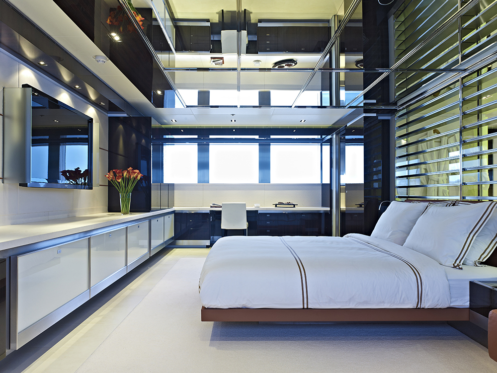 Glowing and reflective ceiling and surface dominates this owner's suite with a rug covered floor and wall and ceiling surfaces gleaming in black Macassar ebony touch. A working counter with white leather chair is provided in the corner with a black cabinet for storage. Also, a wide screen TV is mounted on the wall for entertainment. Glowing and reflective ceiling and surface dominates this owner's suite with a rug covered floor and wall and ceiling surfaces gleaming in black Macassar ebony touch. A working counter with white leather chair is provided in the corner with a black cabinet for storage. Also, a wide screen TV is mounted on the wall for entertainment.