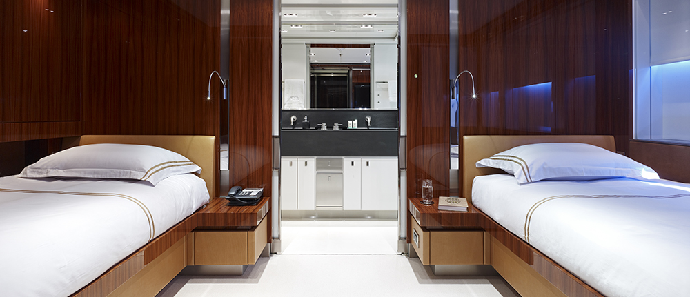 This is the guest cabin accommodating two beds. Finished with glowing and reflective wood Macassar ebony, leather outlining bed headboard and bottom. Adjacent to this is a bathroom with under sink and complete bathroom fixtures. This is the guest cabin accommodating two beds. Finished with glowing and reflective wood Macassar ebony, leather outlining bed headboard and bottom. Adjacent to this is a bathroom with under sink and complete bathroom fixtures.
