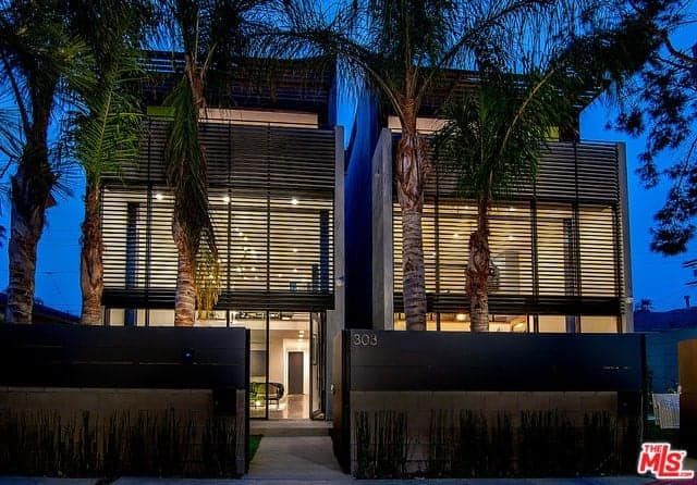 Gated Oasis with Huge Museum-Style Walls, Exposed Steel Beams, and Oversized Windows