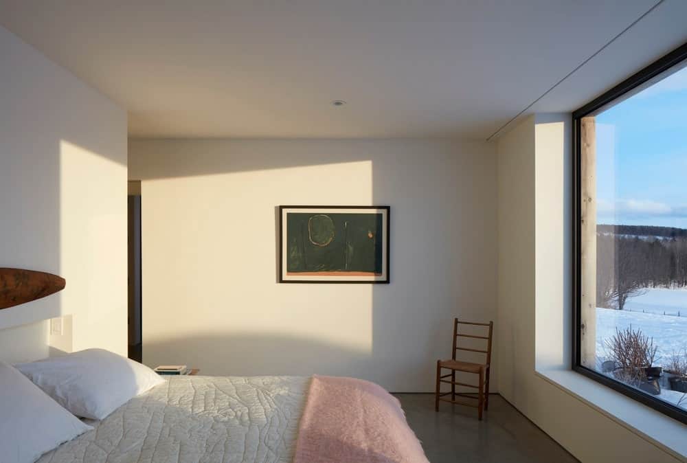 This Scandinavian-style room makes up for its small floor area with an abundance of natural light coming from the massive window at the foot of the bed. This will give you a sense of sleeping amongst nature but in the comfort of the house.