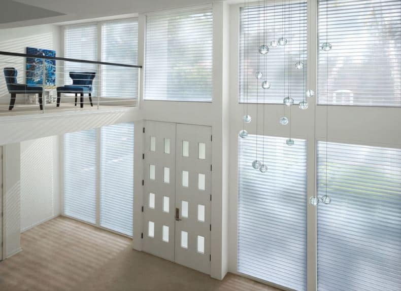 This large grand foyer has a high white ceiling that is adorned with multiple spherical crystal decors. The whole wall of the foyer is filled with tall glass windows with blinds that filter the abundant natural lighting that bathes the whole foyer.